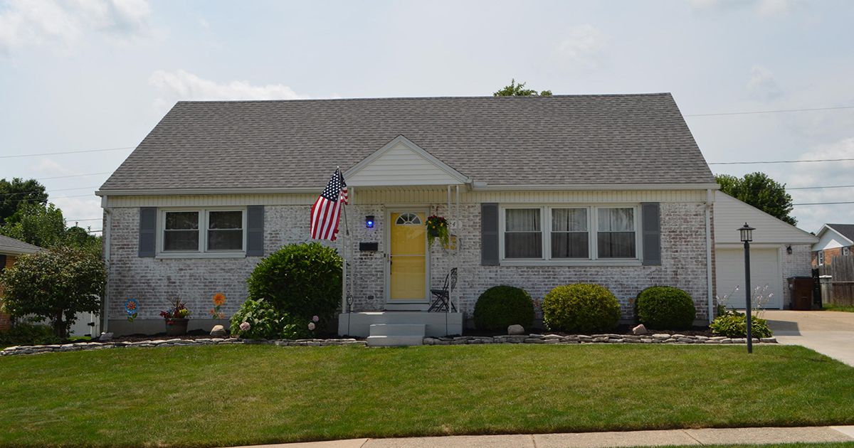 Brick, Cape Cod-style residence consists of partially completed basement