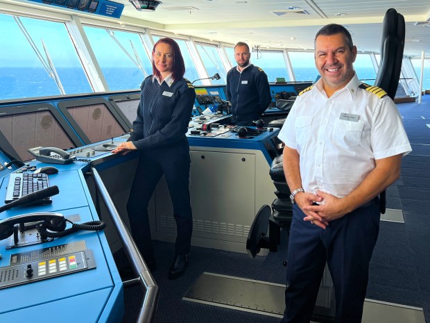 Capt. Theo Zakkas is joined by his first and second officers on the Celebrity Solstice bridge. (Photo by David Dickstein)