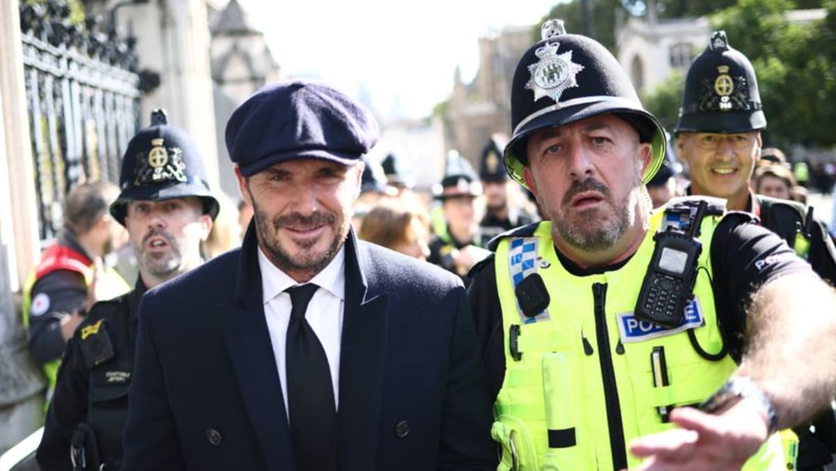 Former England soccer captain Beckham queues to see Queen Elizabeth’s coffin