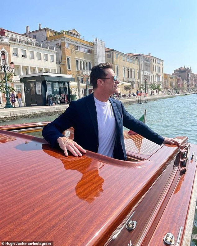 Hugh Jackman is the epitome of favor as he poses on the Grand Canal in Venice