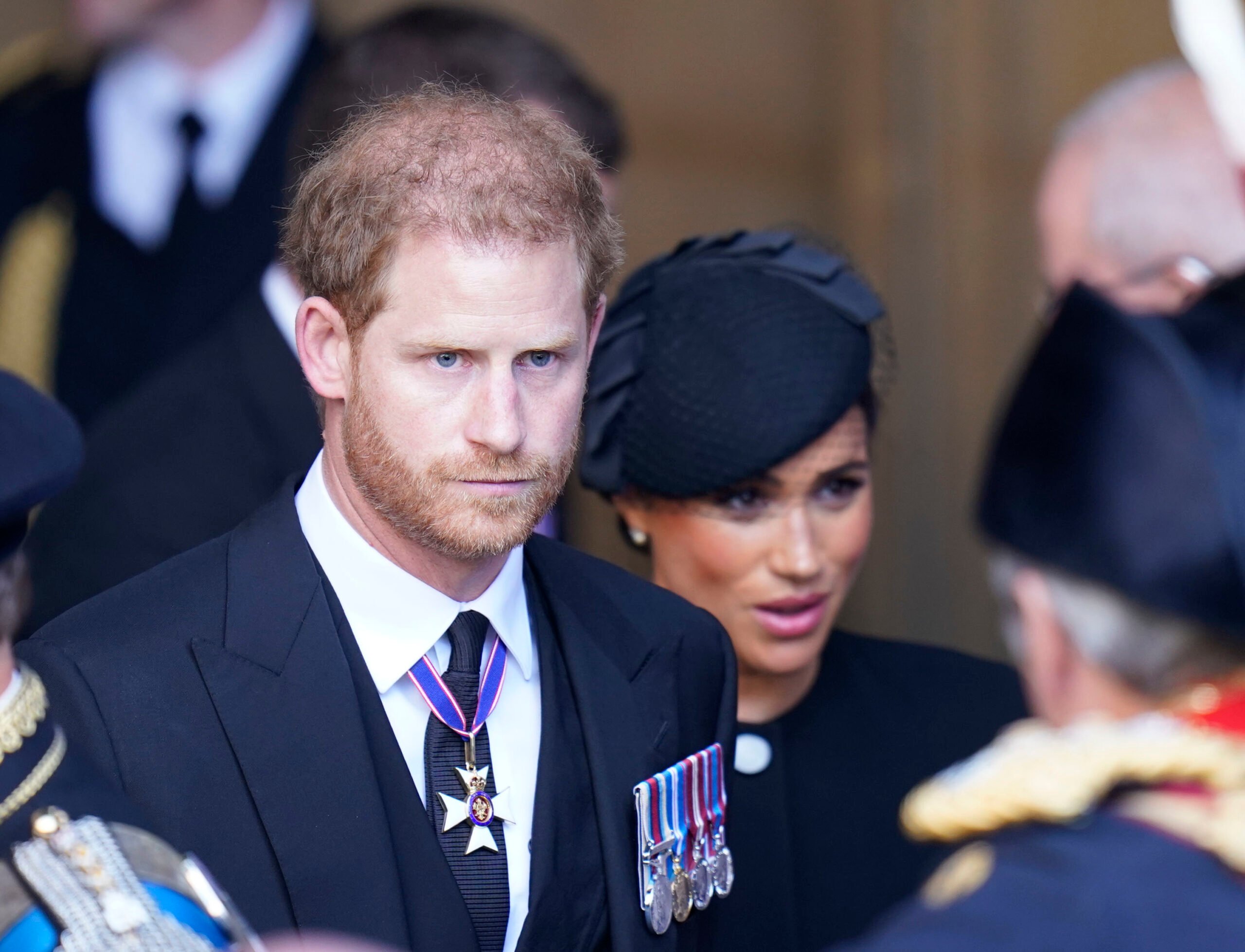 Meghan Markle & Prince Harry: “Demoted” Alongside With Prince Andrew Following Queen’s Demise