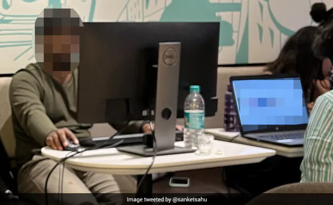 Bengaluru Man Units Up Desktop In Espresso Store As Workplace Will get Flooded