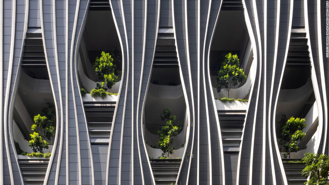 ‘Biophilic’ skyscraper bursting with 80,000 vegetation opens in Singapore