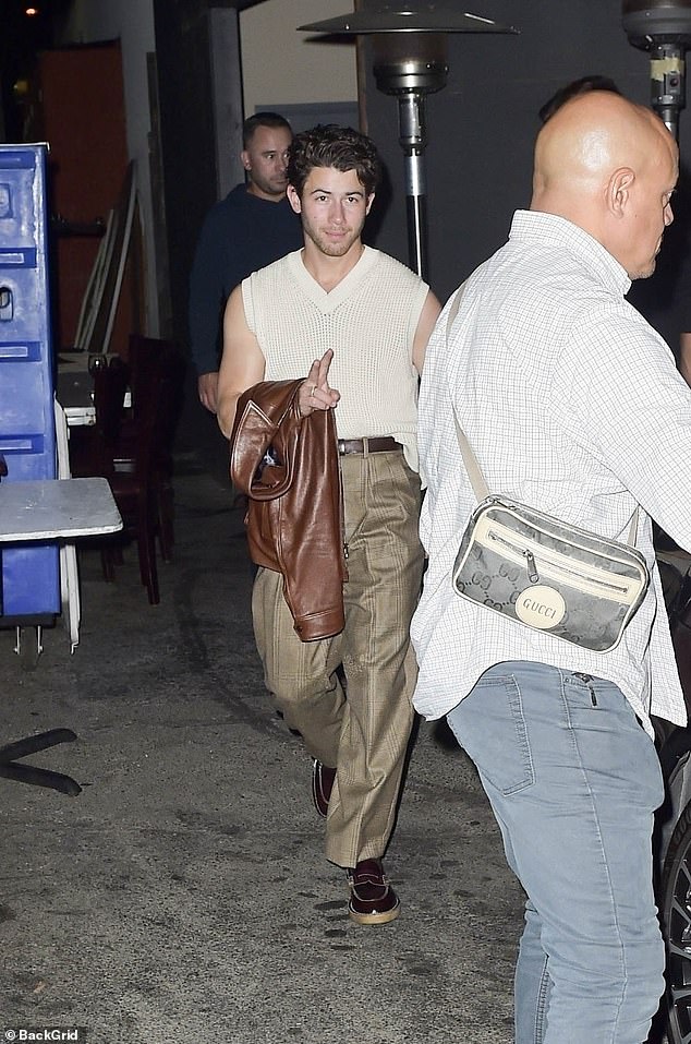 Nick Jonas appears to be like informal in a sweater vest as he leaves movie star hotspot Craig’s in West Hollywood