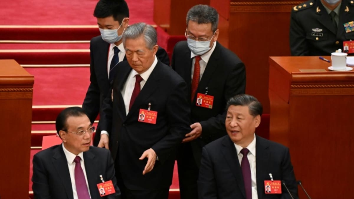 Former China president Hu Jintao unexpectedly leaves Congress closing ceremony