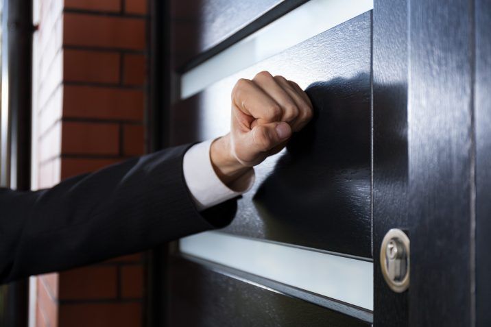 Man knocking on doorways to discover a lighter found with hashish