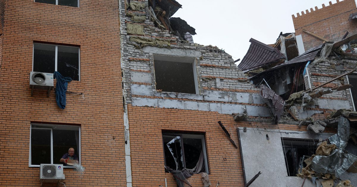 Russia hits Ukraine houses, evacuates Kherson, warns of escalation