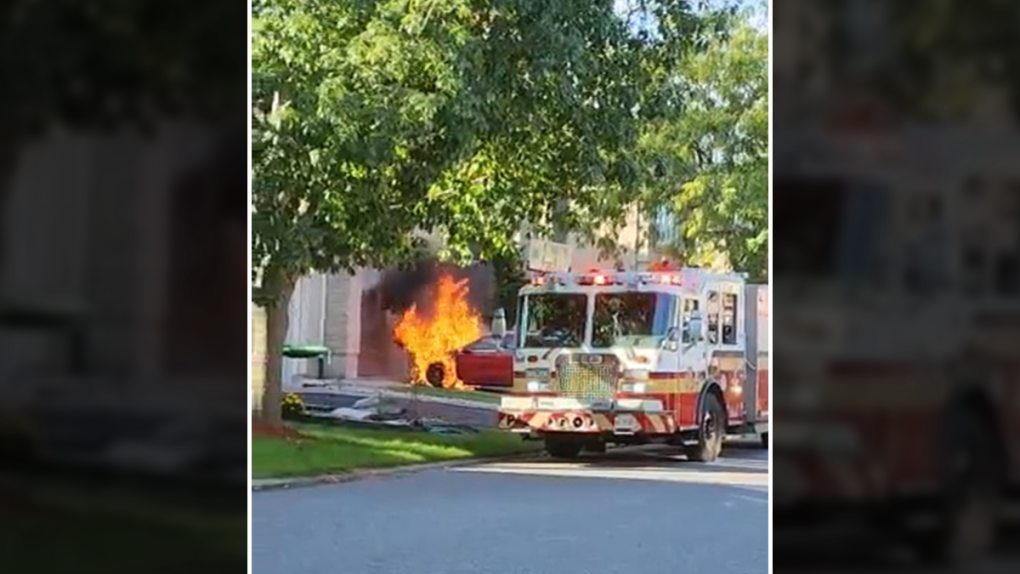 House undamaged after automotive bursts into flames in driveway