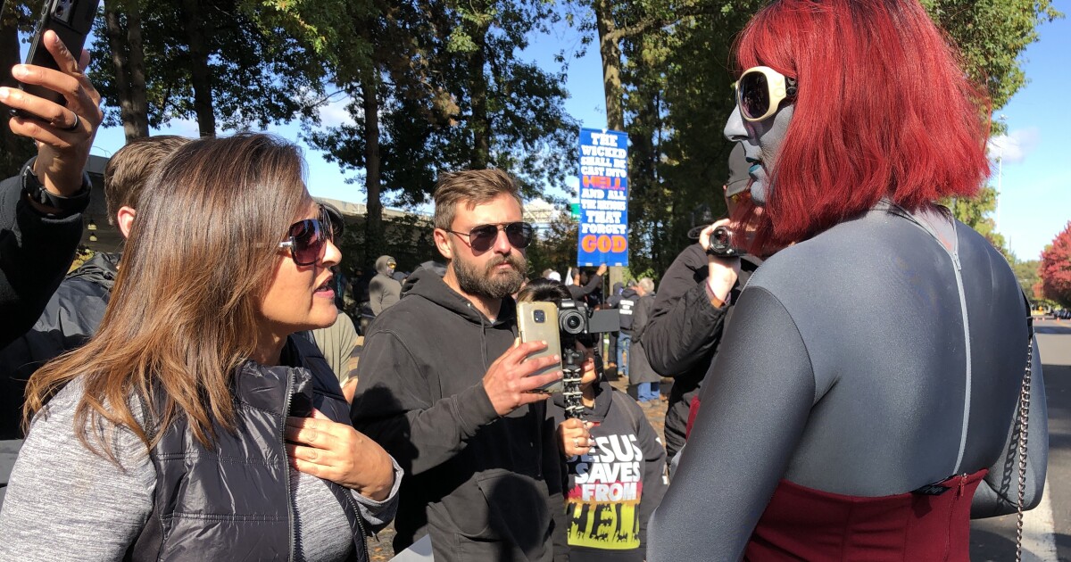 Prickly confrontations occur outdoors Eugene pub, however drag queen story time occasion goes on with no hitch