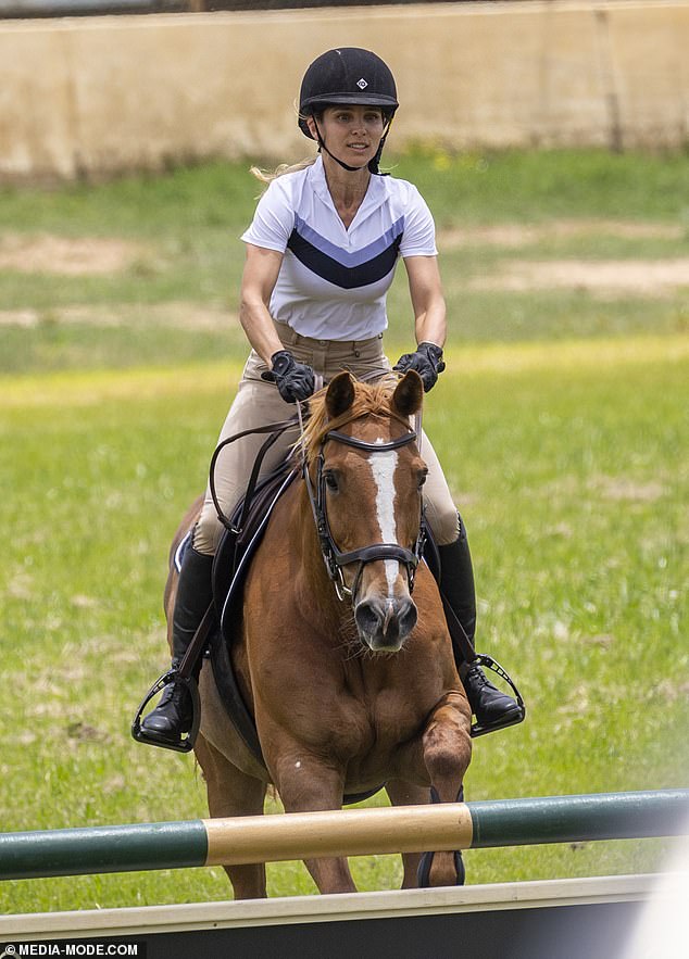 Ageless Elsa Pataky flaunts her unimaginable legs in tight jodhpurs at a horse using occasion