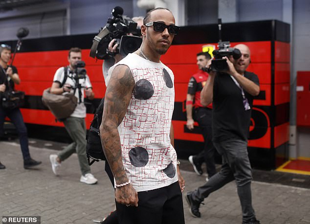 Lewis Hamilton reveals off his model as he rocks a noticed white tank prime at Sao Paulo F1 Grand Prix