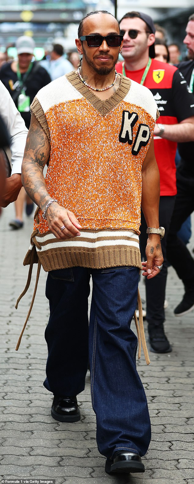 Lewis Hamilton exhibits off his daring sense of fashion in a Kenzo sweater vest for the Brazil Grand Prix