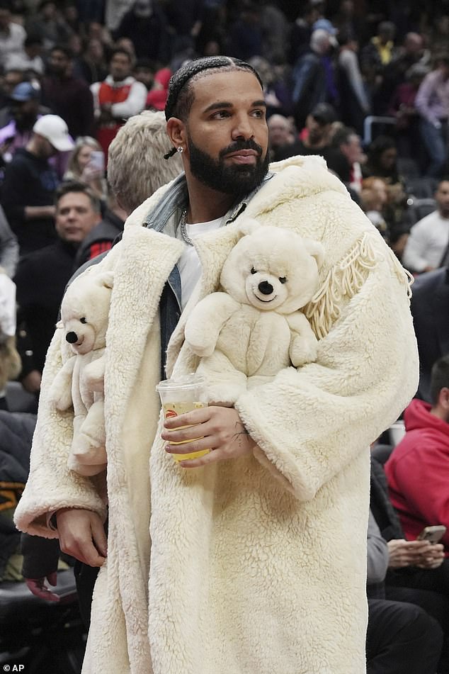 Drake reveals off his quirky sense of fashion in kooky coat adorned with teddy bears at basketball sport