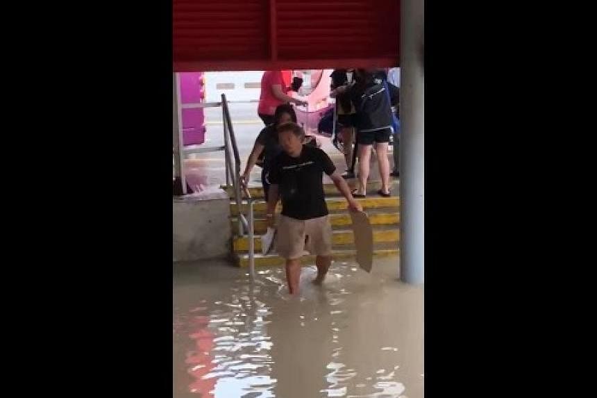 Flooding at Tanah Merah MRT station entrance throughout heavy rain on Saturday