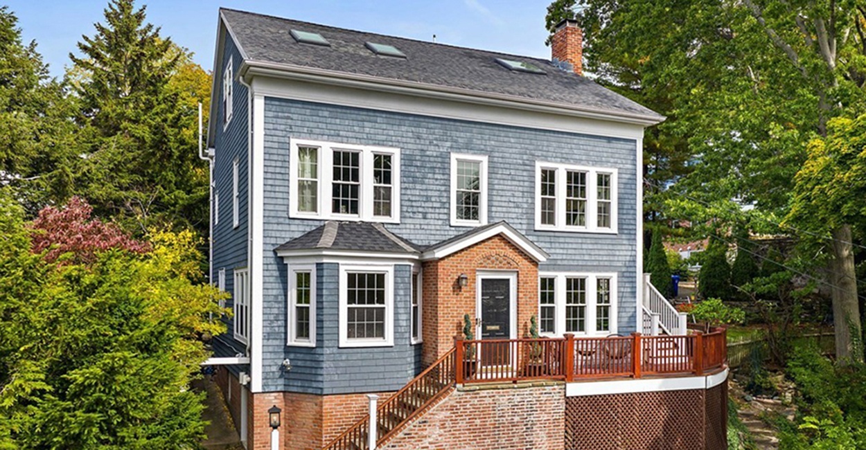 A Hillside House in Brookline with a Wraparound Deck