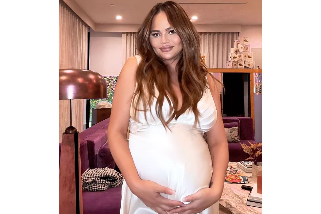 Pregnant Chrissy Teigen Exhibits Off Bump in Slip Costume: Picture