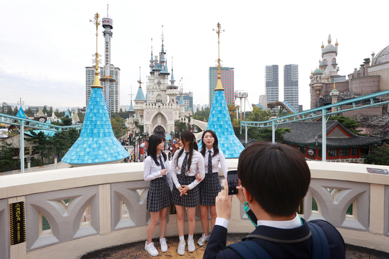 Adults dressed in school uniforms at a local theme park Everland in Yongin, Gyeonggi [YONHAP]