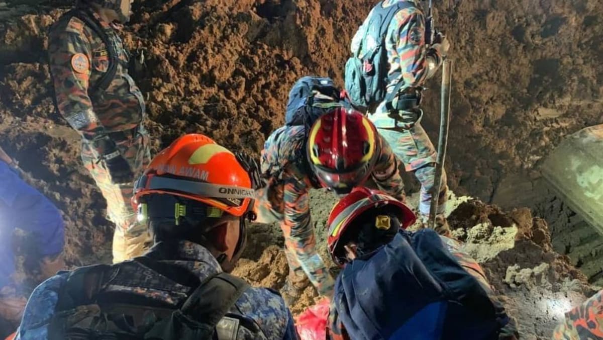 Physique of man hugging canine recovered as Malaysia landslide loss of life toll rises to 26