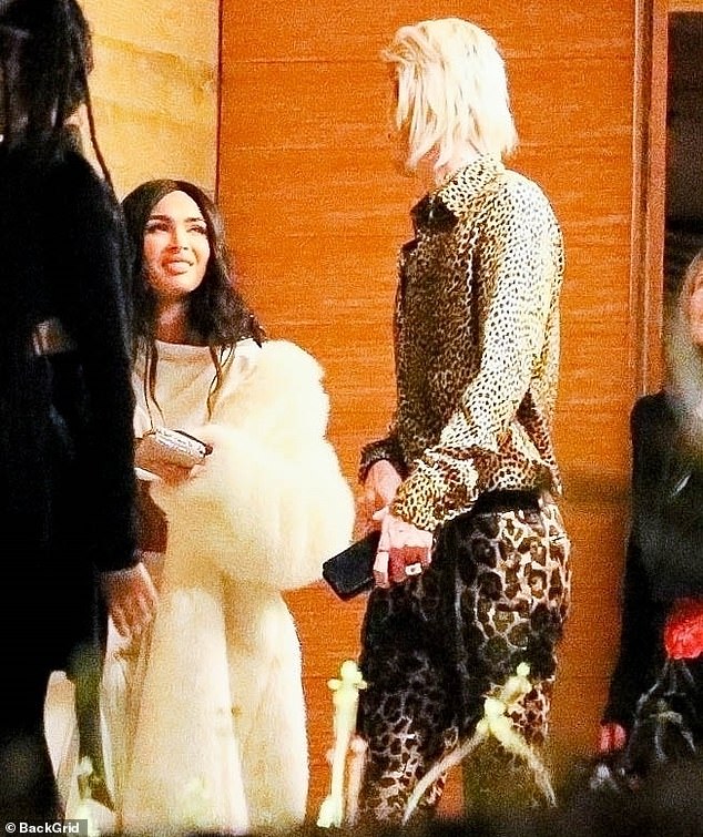 Megan Fox and MGK put a twist on Magnificence and the Beast as they head out to rejoice Christmas Eve