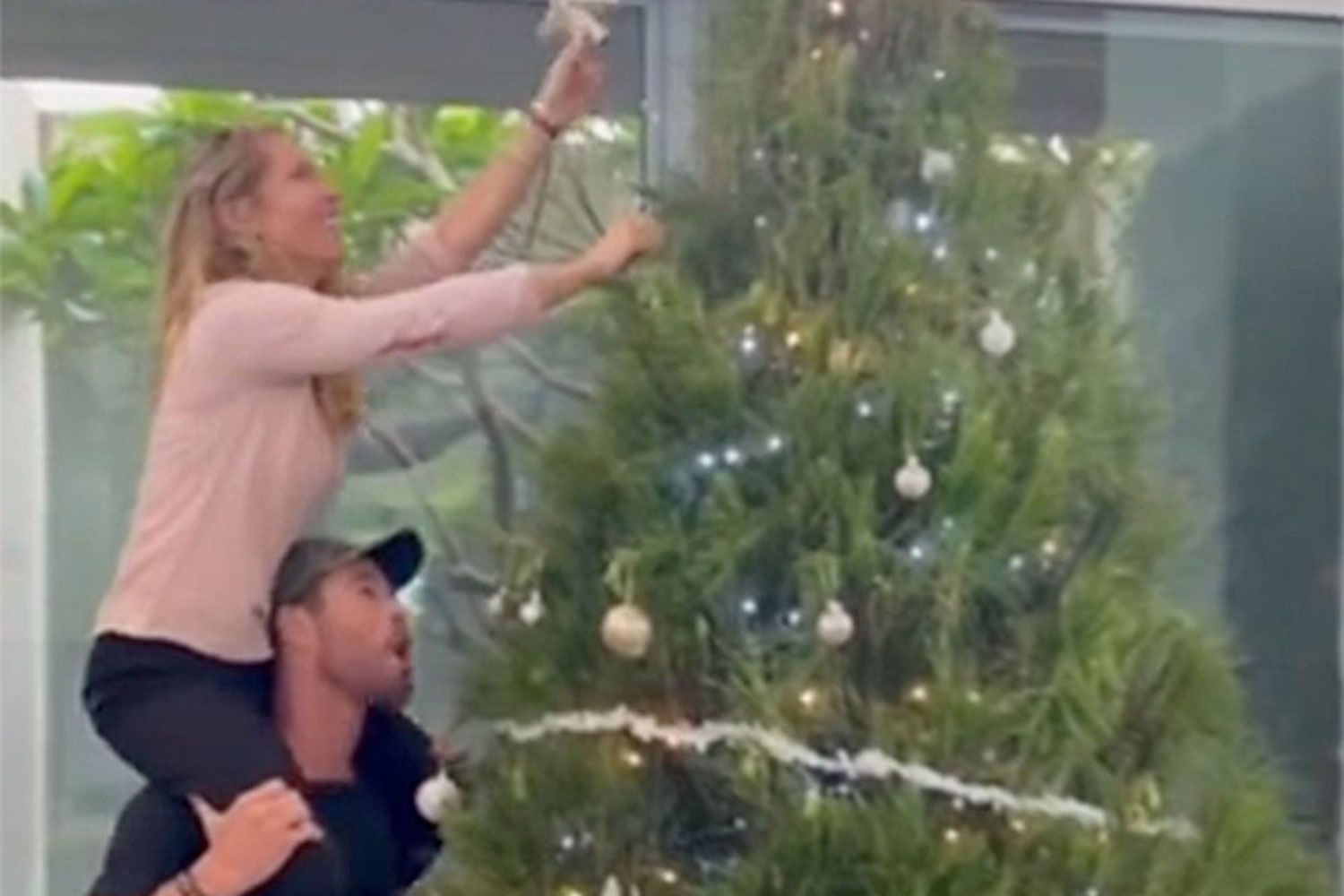 Chris Hemsworth Lifts Elsa Pataky on His Shoulders to Embellish Christmas Tree