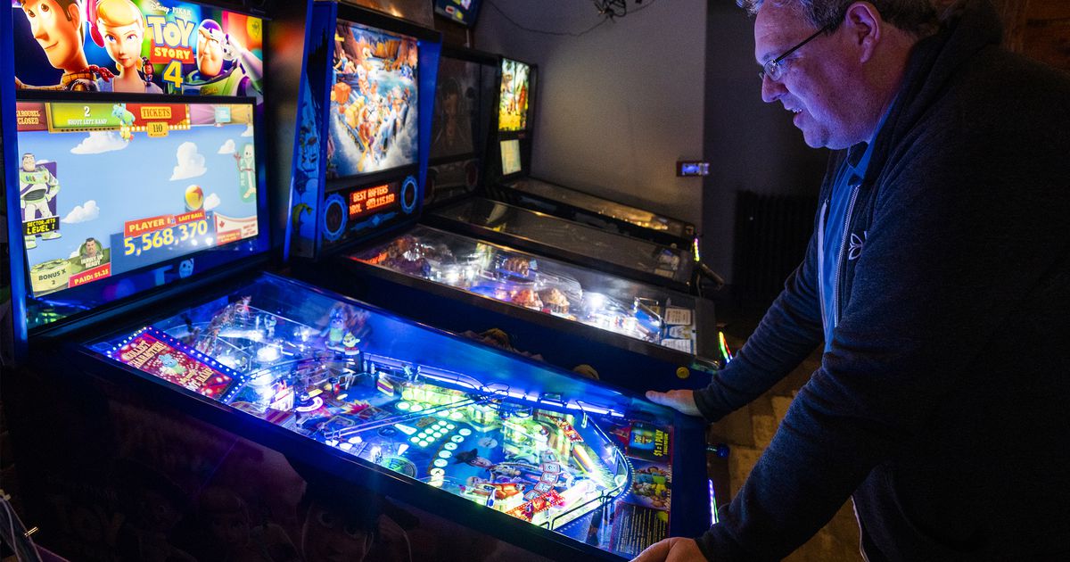 An Ogden bar spotlights pinball machines, each traditional video games and new ones