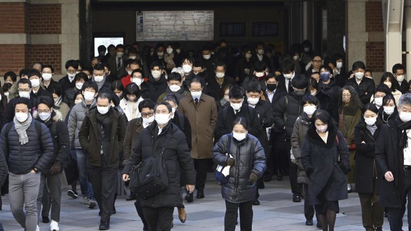 Japan considers downgrading Covid-19 to similar degree as seasonal flu