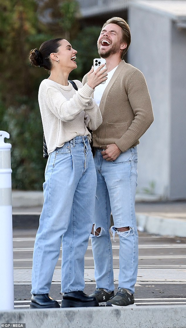 Derek Hough and fiancee Hayley Erbert share a couple of laughs and smiles whereas out procuring in LA