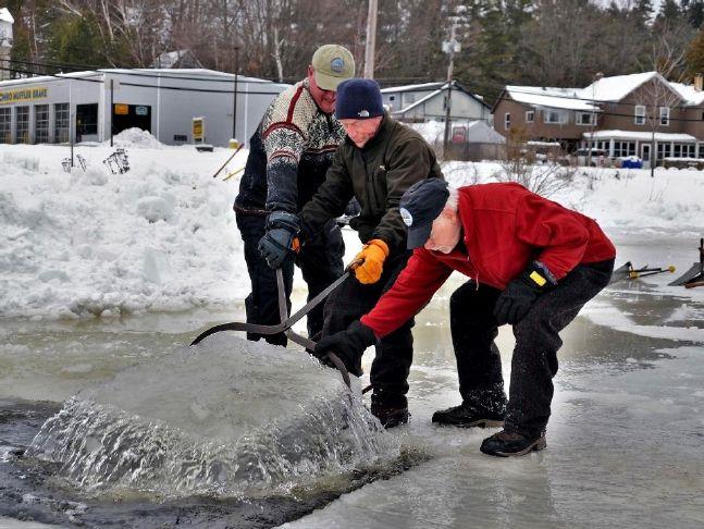 All arms at work on Saranac Lake Winter Carnival Ice Palace – Solar Group Information & Printing