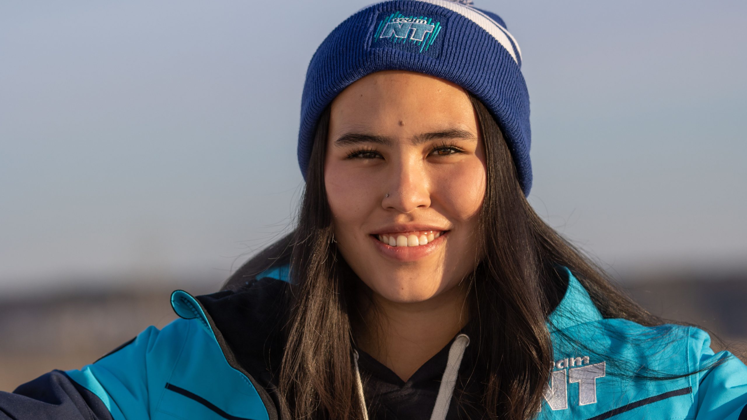 Kyra McDonald to hold NWT flag at Arctic Winter Video games ceremony