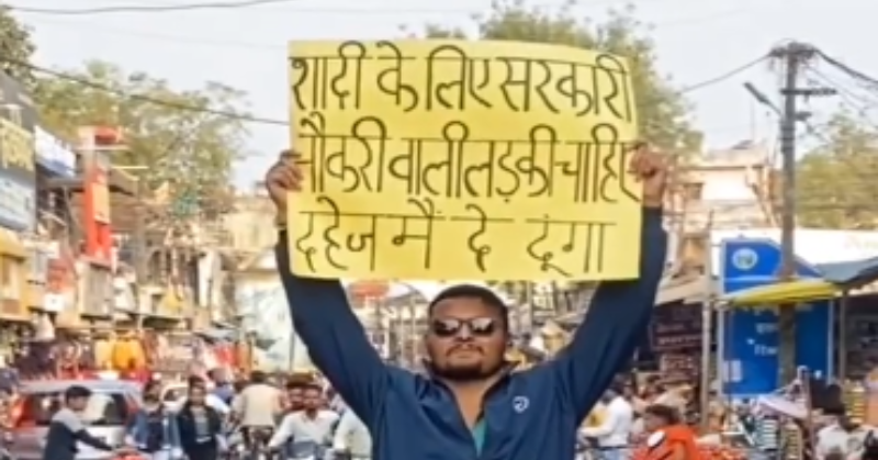 Man Appears to be like For His Future Bride In Crowded Market With Matrimonial Poster