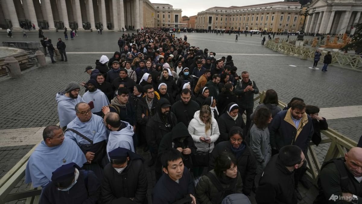 Tens of hundreds pay tribute to ex-pope Benedict at lying-in-state